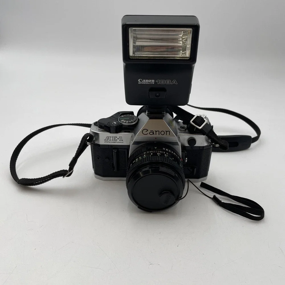 Vintage Canon AE-1 35mm SLR Film Camera +Canon 50 mm 1:1.8 Lens +Canon 188AFlash